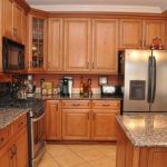 kitchen-wall-colors-with-dark-oak-cabinets-using-golden-yellow-color-and-natural-wood-varnish-for-cabinet-kitchens-including-freestanding-refrigerator-600×398