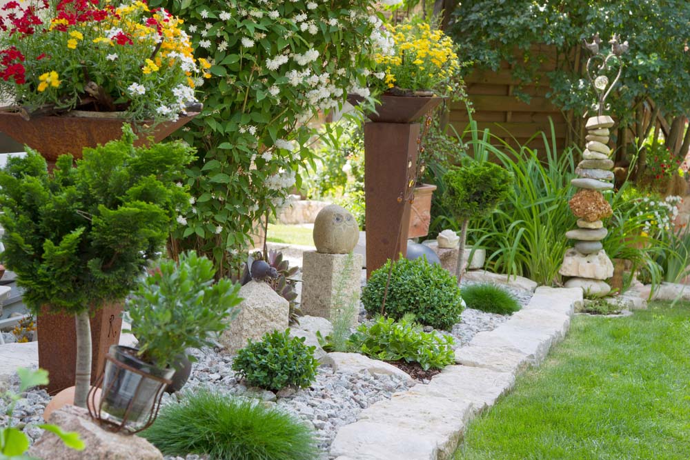 Rock sculpture with container home garden